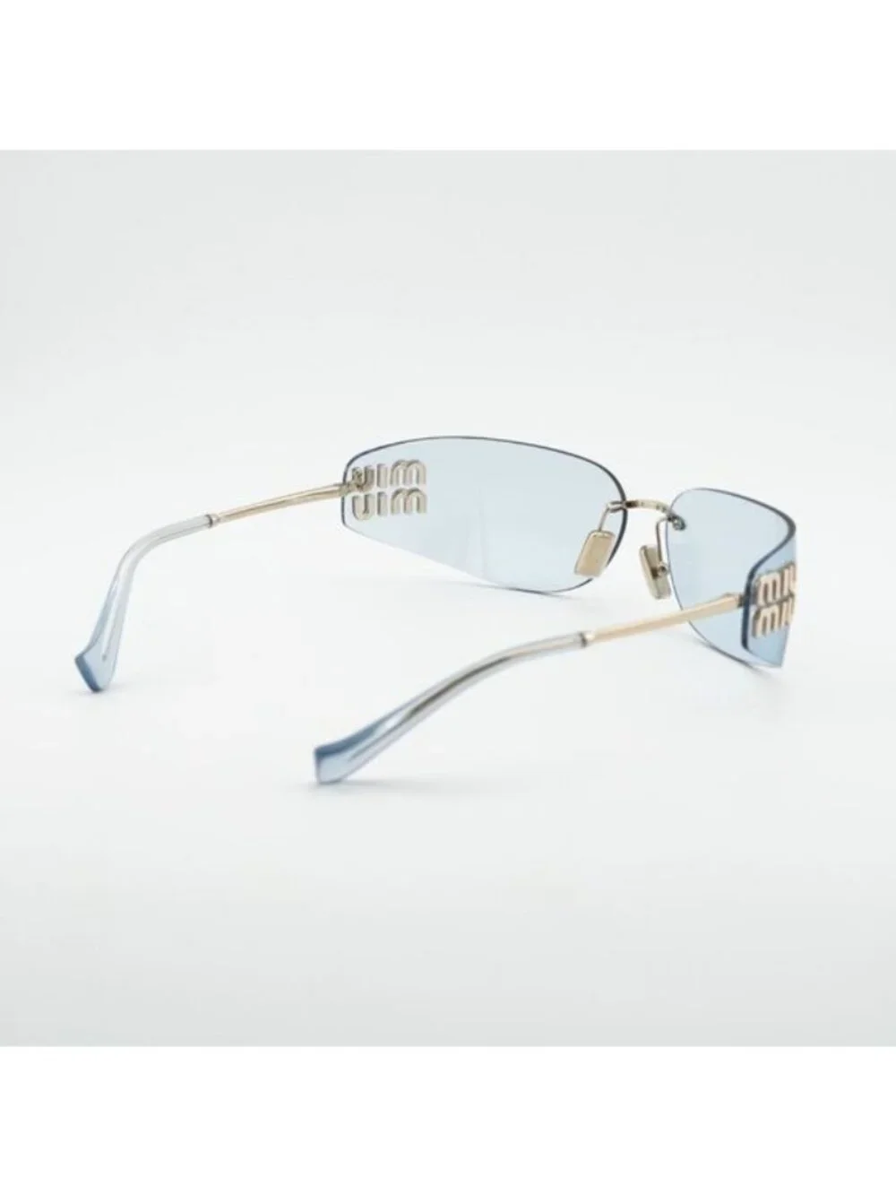 Miu Miu MUA51S ZVN10P Sunglasses Pale Gold Rectangle Frame, Light Blue Lenses